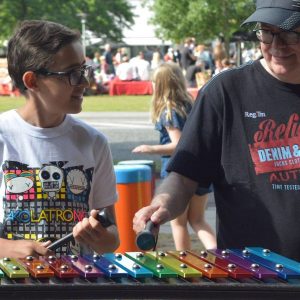 Capella Outdoor Music Instrument (grandson and grandfather playing)