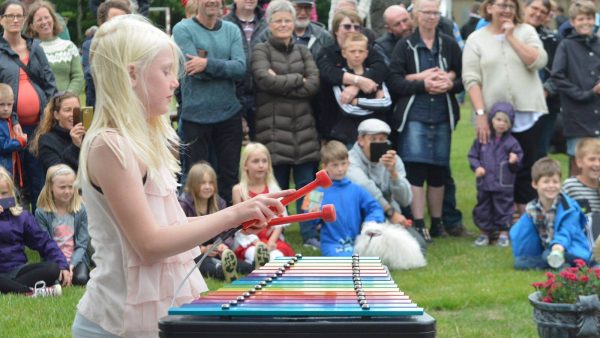 Capella Outdoor Music Instrument (young girl playing; right side view)