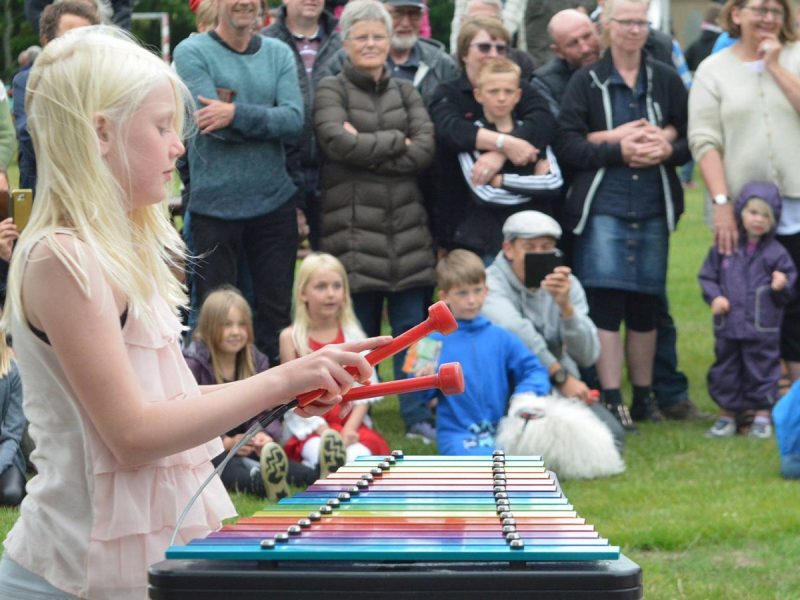 Capella Outdoor Music Instrument (young girl playing; right side view)
