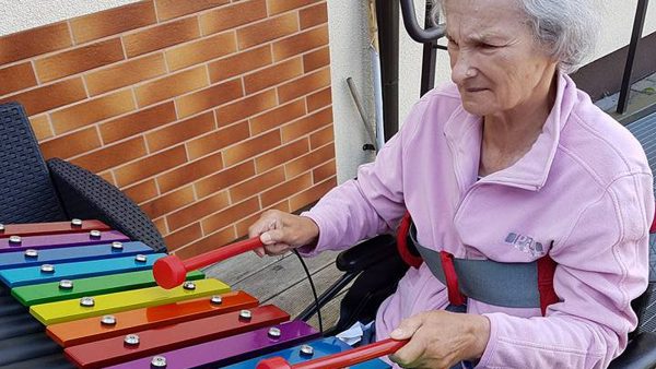 Cavatina Outdoor Music Instrument (elderly woman playing)
