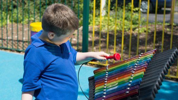 Cavatina Outdoor Music Instrument (special needs boy playing)