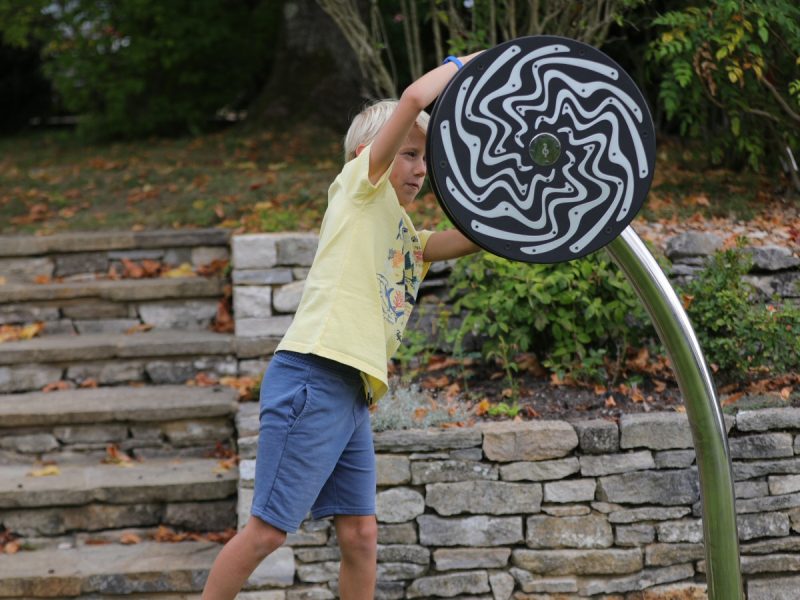 Cyclone Outdoor Music Instrument (young boy playing; view 2)