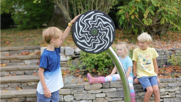 Cyclone Outdoor Music Instrument (young girl and 2 boys playing)