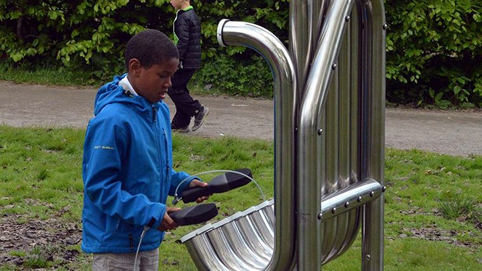 Diatonic Tembos Outdoor Music Instrument (boy playing; right side view)