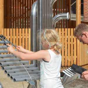 Pentatonic Tembos Outdoor Music Instrument (2 young girls and father playing)