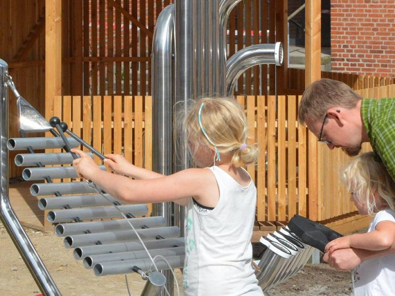Pentatonic Tembos Outdoor Music Instrument (2 young girls and father playing)