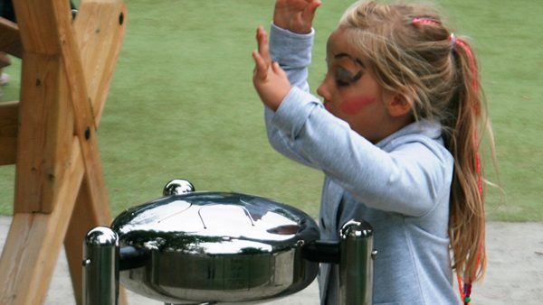 Percussion Play Babel Drum (small; young girl with face paint playing)