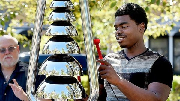 Percussion Play Bell Lyre Outdoor Bells (old man, and younger man playing)