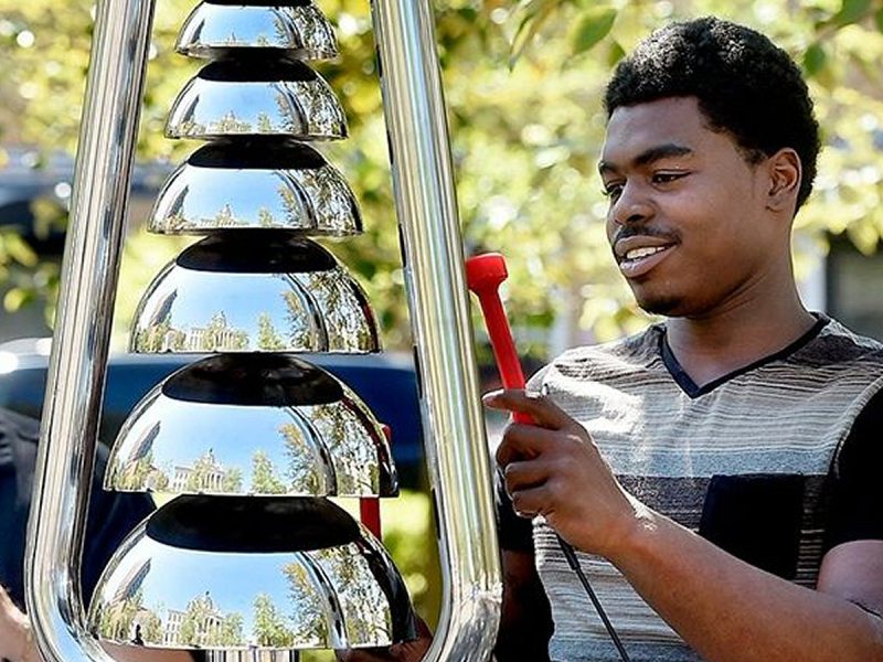 Percussion Play Bell Lyre Outdoor Bells (old man, and younger man playing)