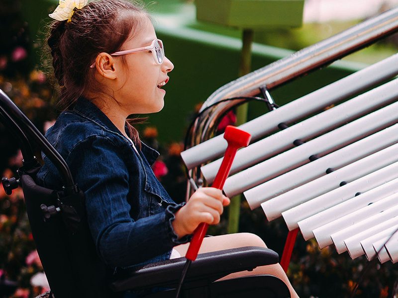 Percussion Play Papilio Bells (1 young woman in wheelchair playing)