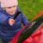 Percussion Play Poppy Petal Drum (small child playing; top view)