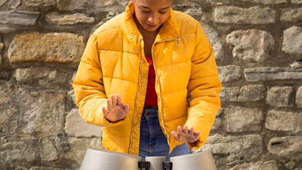 Percussion Play Tumbadoras (young woman playing)