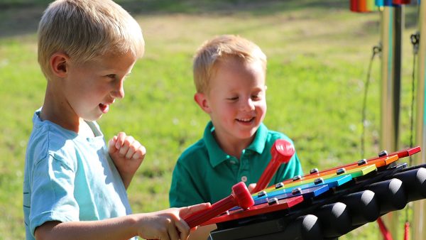 Rainbow Metallophone Outdoor Music Instrument (2 boys playing; right side view)