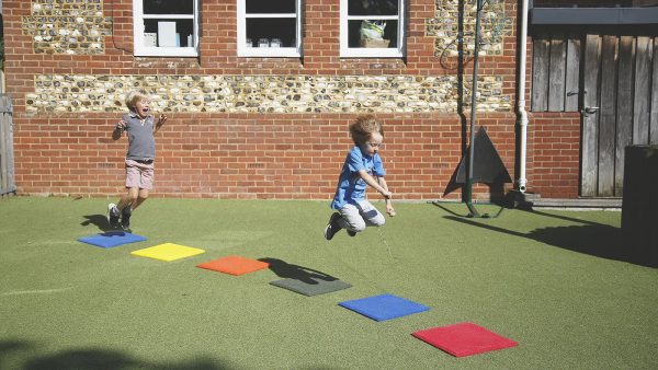 Stepping Stones Outdoor Music Instrument (2 boys jumping)