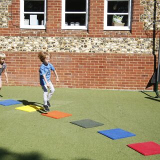 Stepping Stones Outdoor Music Instrument (2 boys playing)