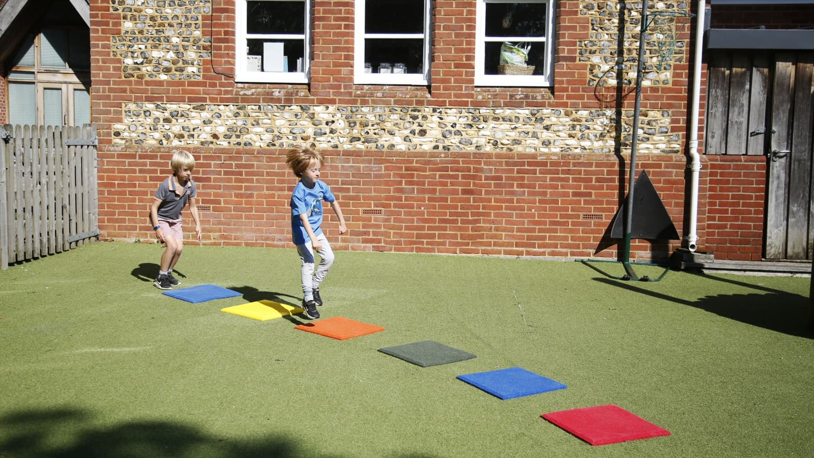 Stepping Stones Outdoor Music Instrument (2 boys playing)