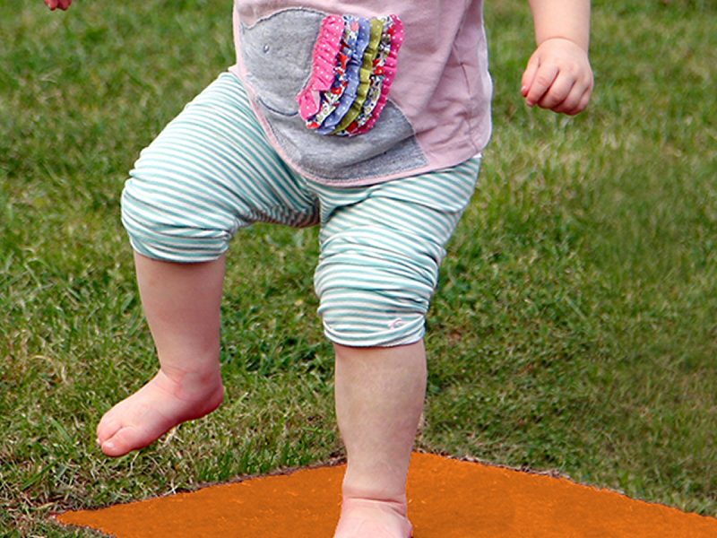 Stepping Stones Outdoor Music Instrument (toddler jumping; chord D in orange)