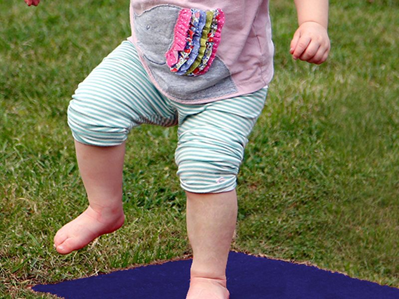 Stepping Stones Outdoor Music Instrument (toddler jumping; chord G in blue)