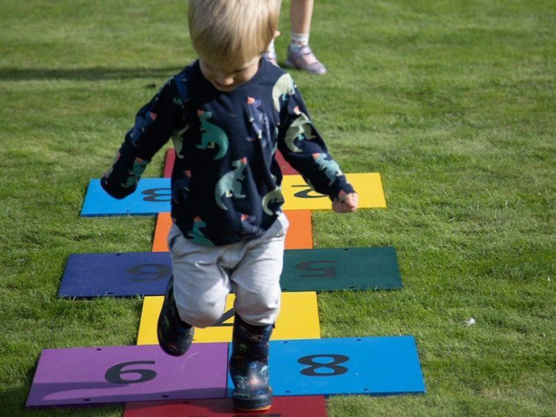 Harmony Hop Outdoor Music Instrument (little boy playing)