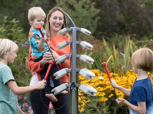 Temple Block Tree Outdoor Music Instrument (children playing with their mother)